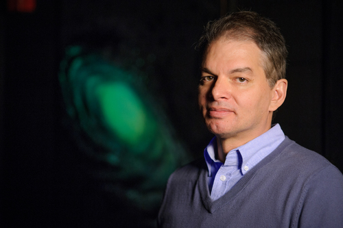 Chris Adami, professor of microbiology and molecular genetics, pose at Abrams Planetarium on March 6, 2014.